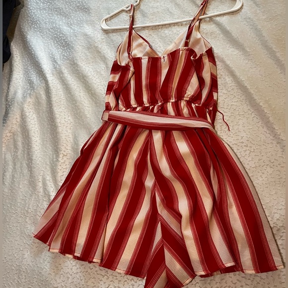 Small Francesca’s Red Striped Pinwheel Romper - Picture 2 of 3